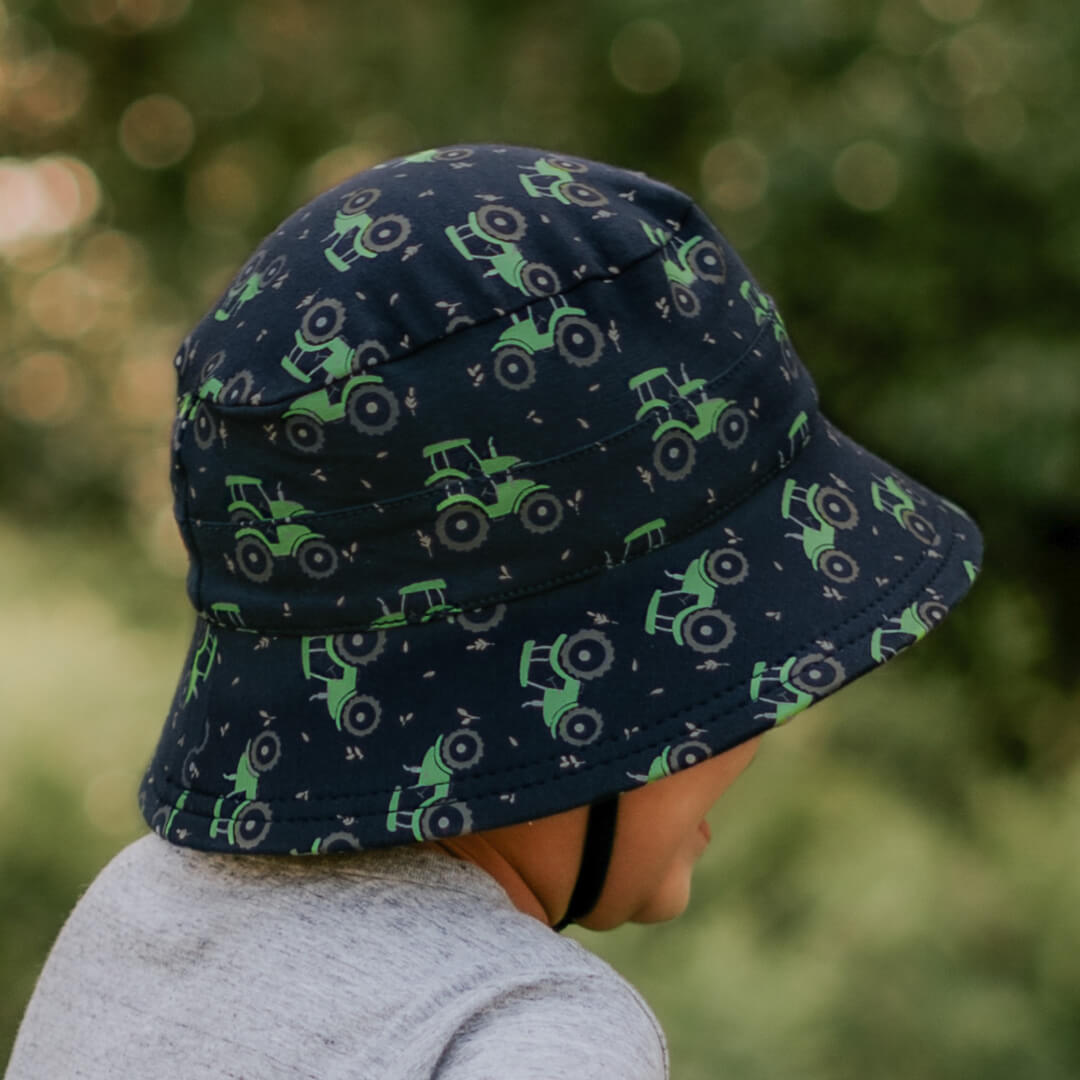 3 year old boy wearing Bedhead Hats Tractor bucket hat with green tractors