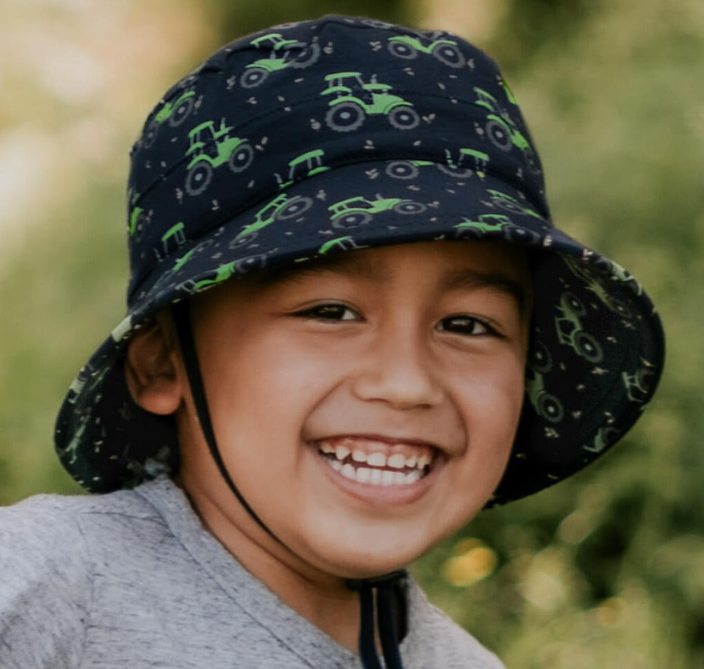 Bedhead Hats sun hat for boys with green tractor on navy background