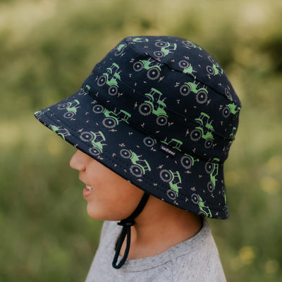 Bedhead Hats Tractor sun hat worn by a 4 year old boy with chin strap done up