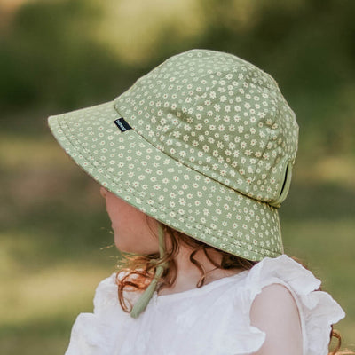 Green ponytail hat with white daisies on girl from Bedhead Hats