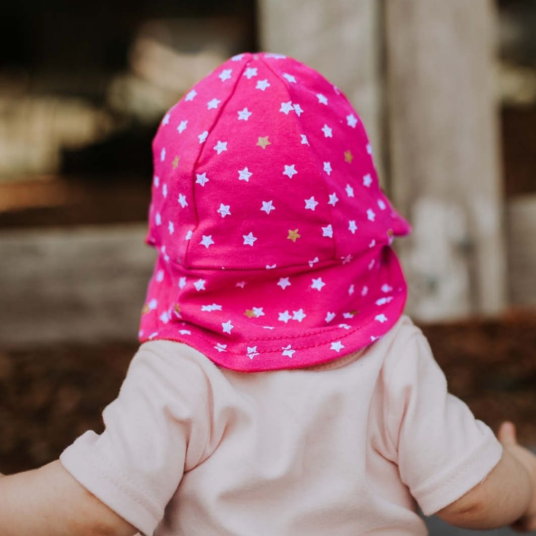 Back view of Bedhead Hats Nova print on baby girl