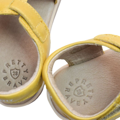 Close up of Pretty Brave logo on sandals