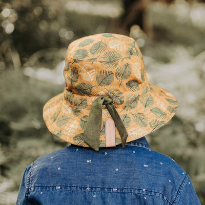 Bedhead Hats boys sun hat with olive and white leaf print on mustard background with olive green linen tie